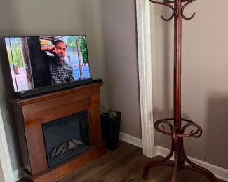 Electric fireplace with remote, 42” OLED TV (works perfectly), 1904 mahogany coat tree from paris