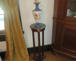green marble plant stand with vase