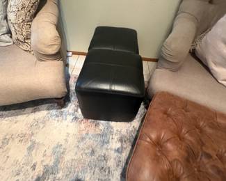 . . . two small ottomans