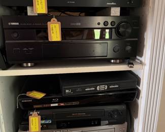 Bang & Olufsen (B&O), Denon Pro, Adcom, and Panamax, including amplifiers, receivers, speakers, turntables, cassette decks, CD players, subwoofers, and audio accessories.