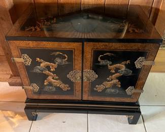 Vintage Asian-inspired black lacquer accent cabinet featuring hand-painted tiger motifs