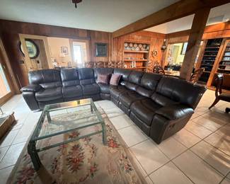 Large dark brown leather sectional with two end recliners