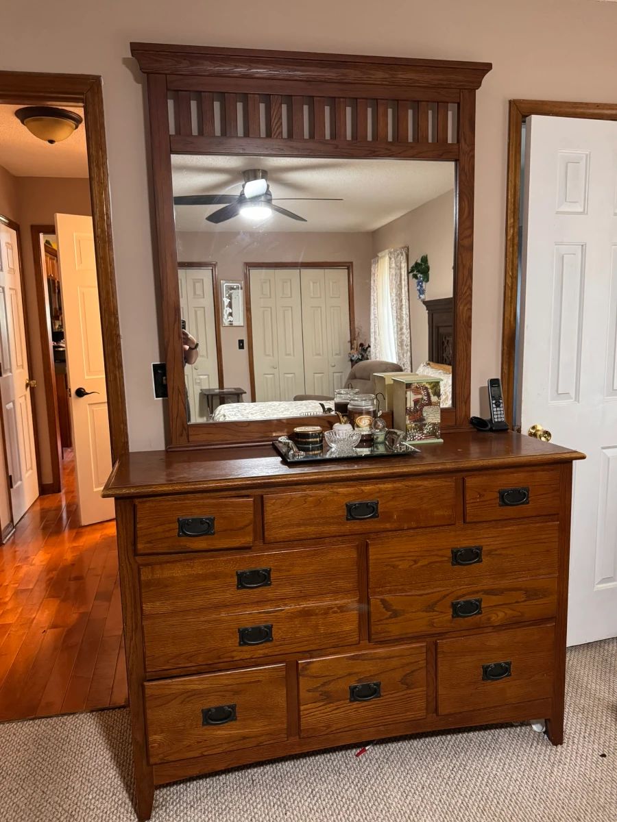 Beautiful solid wood dresser featuring six spacious drawers and a large framed mirror. The warm wood finish and dark metal handles give it a classic, sturdy look. Great for a bedroom, guest room, or furniture restoration project.