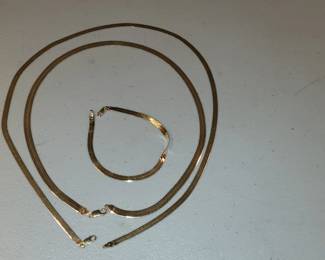 Gold herringbone necklaces and bracelet