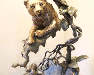 Mark Hopkins bronze scupture, "Night Hunter". Features a detailed leopard perched on a tree branch. Edition number 137/750. Stand included.