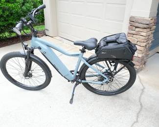 Ride One Up 700 Series electric commuter bike with pannier bag.