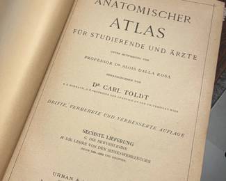 Antique German medical books, including Anatomischer Atlas für Studierende und Ärzte by Carl Toldt—anatomy and medical-history collectible.