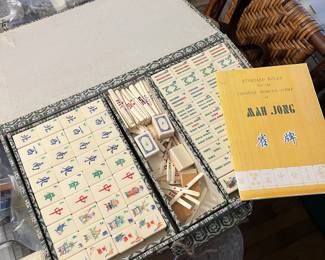 Mah Jong game set with tiles, racks, instruction book and original storage case.