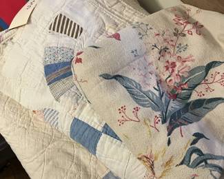 Handmade vintage quilts and various fabrics, including vintage tropical barkcloth..