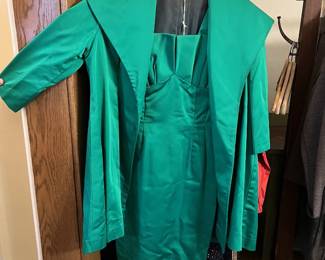 Vintage emerald-green women’s dress with matching jacket—classic midcentury fashion and special-occasion clothing.