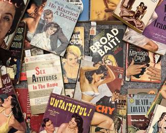 Collection of racy vintage pulp paperbacks with midcentury retro illustrated cover art.