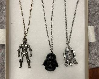 Vintage Star Wars character necklaces featuring Darth Vader, C-3PO and R2-D2.
