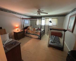 Antique queen bed and several twin beds; treadmill