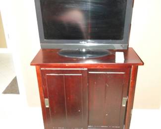 Another smaller TV, and cabinet.