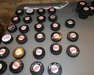 Signed Red Wings hockey pucks