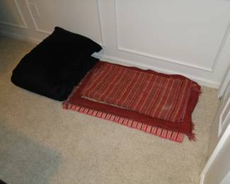 A very nice comfortable body pillow, and some wonderful throw rugs