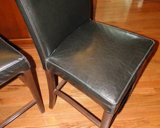 All chairs that are in the kitchen are counter top height