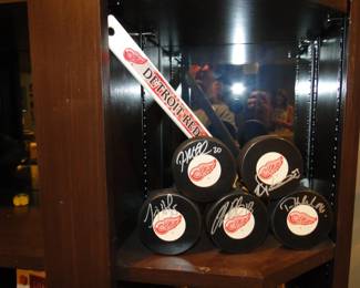 Red Wings, signed hockey pucks