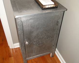 Silverish, storage cabinet. Just so you know that this is not made with real silver