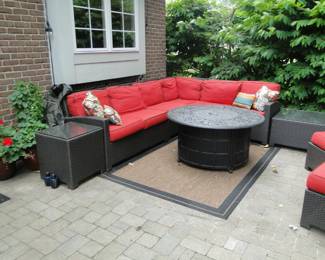 Another fine view of that outdoor sectional and firepit, andsome other outdoor extras too, like the tables
