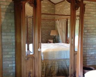 Antique walnut armoire with bevelled mirrors