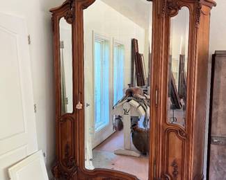 Antique walnut armoire with bevelled mirrors