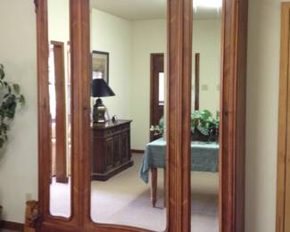 Antique walnut armoire with bevelled mirrors