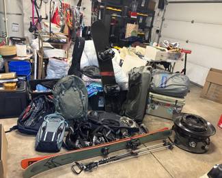 Skis, Snowboard, Patagonia bags, Dakine mountain biking backpacks, yeti cooler, propane fire pit, air mattress
