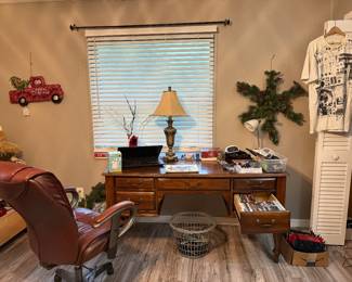 Office desk, chair, laptop, supplies, lamp