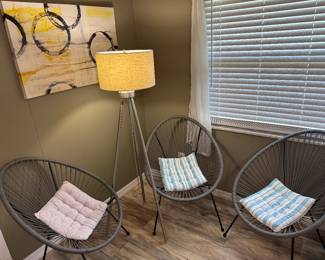 Grey Acapulco chairs, MCM style tall floor lamp, modern art