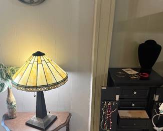 Stained glass lamp, black jewelry armoire with lots of jewelry