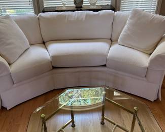 Curved Sectional Sofa and Hexagonal Brass and Glass Coffee Table