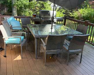 Patio table wicker glass top  and 6 chairs  Needs a wash and chairs re spray painted 