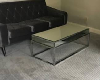 Morro coffee table and grey velvet couch. Perfect for an home office
