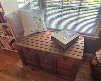 Pine trunk, decorative pillows, family Bible