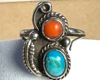 Turquoise ring paired with a red coral accent