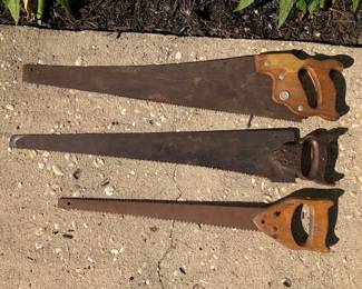 Vintage wood handled saws.