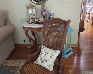 Antique chair, clock, marble top table, vase
