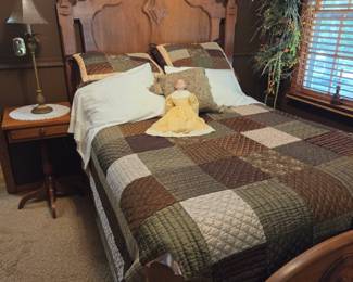 Victorian bed with antique side table