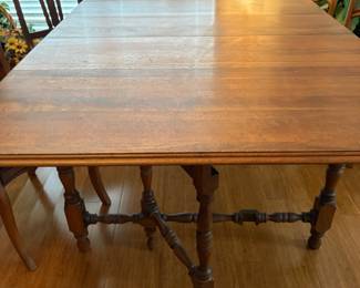 Antique table with several leaves to extend seats 12 people or less