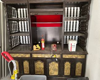 This is a three section wood wall unit/Cabinet