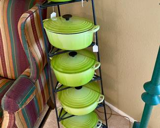 several different size Le Creuset dutch ovens, unusual color
