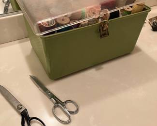 Vintage sewing box filled with vintage sewing notions