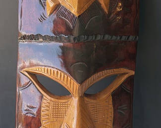 Lot 82: Vertical carved wooden mask sculpture with turtle motif