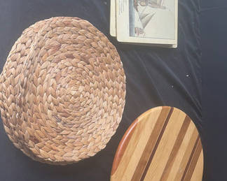 Lot 60: Round woven placemats, striped wooden rounds, nautical ship cards, and a green felt board