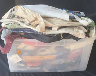 Lot 38: Clear plastic bin with assorted textiles