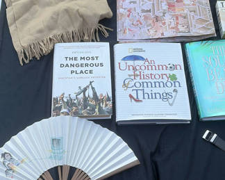 Lot 2: Assorted books, travel journals, and personal accessories