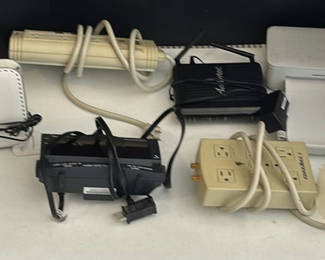 Lot 151: Netgear Router, Ameriphone Alarm Clock, Surge Protector, and Electronics Accessories