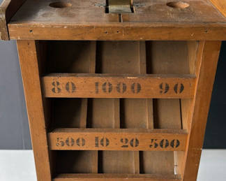 Lot 207: Vintage wooden display stand with slotted compartments and frog sculpture