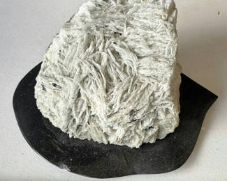 Lot 215: White fibrous crystal mineral on rock matrix